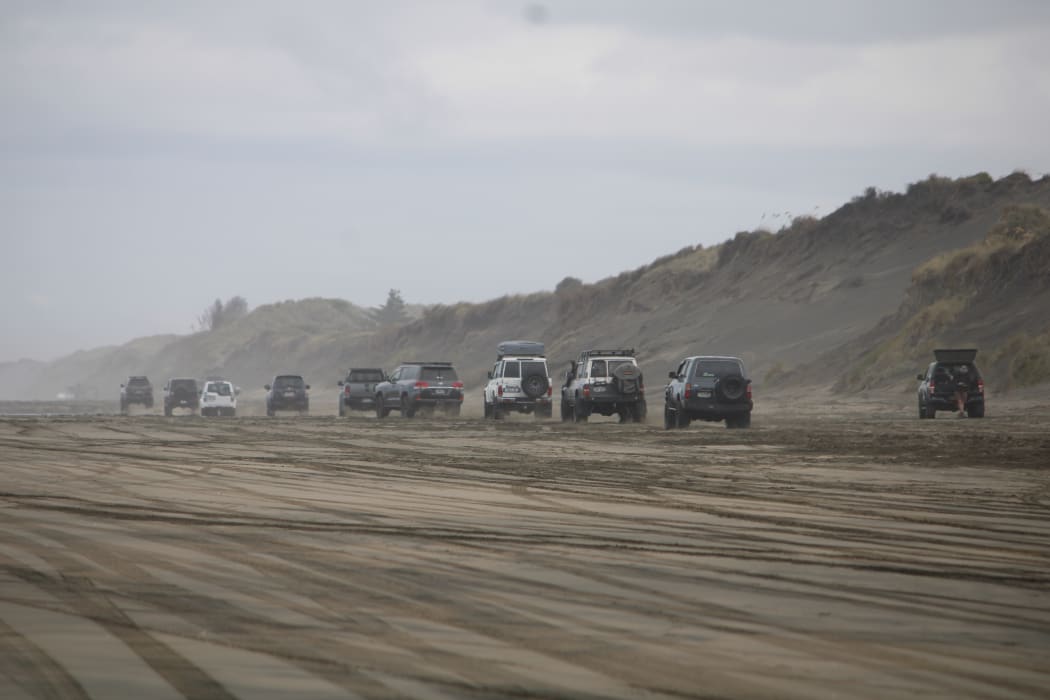 Vehicles on Auckland's Muriwai beach