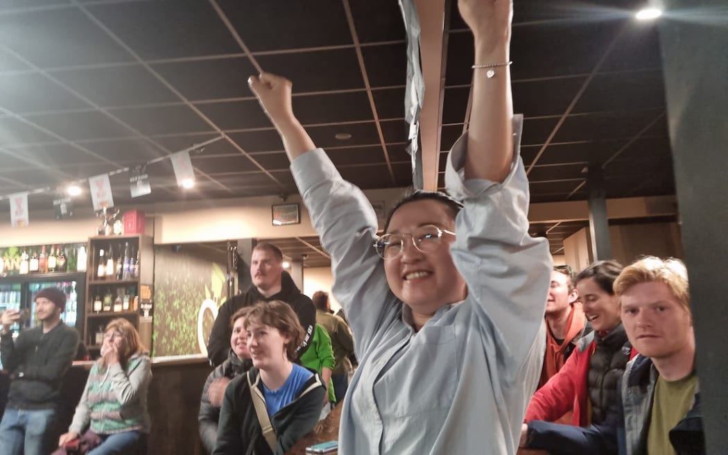 In Nelson from Auckland for a conference, Zoe Qu leapt out of her seat at O'Shedigans to celebrate the All Blacks win, she's a big fan and said the team played well.