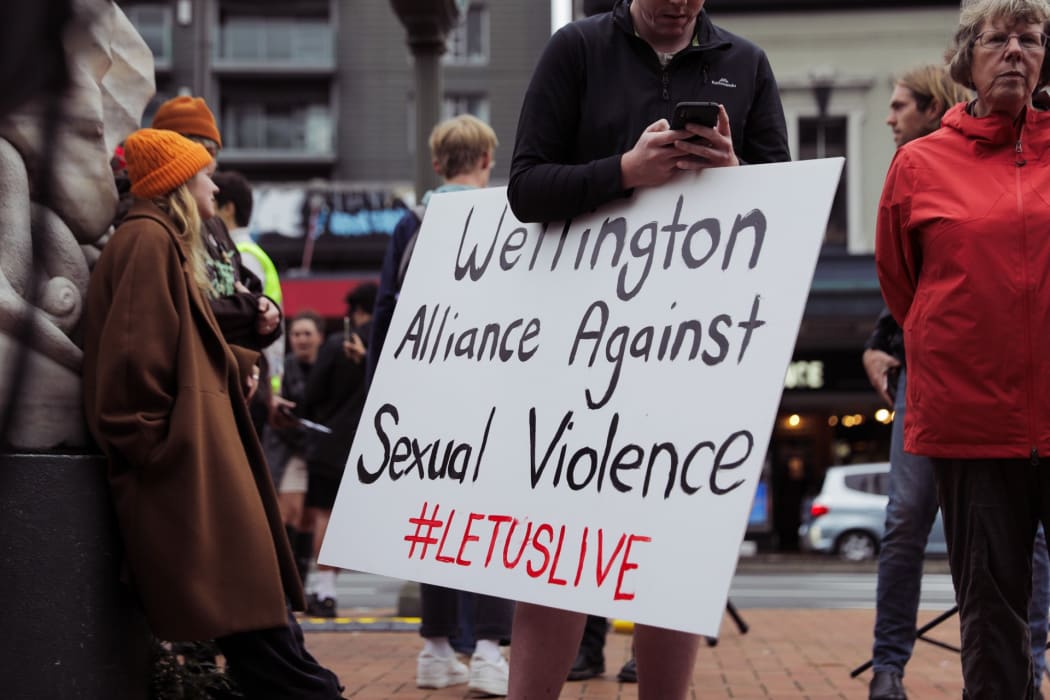 People gathered on Courtenay Place in Wellington to rally against sexual violence.