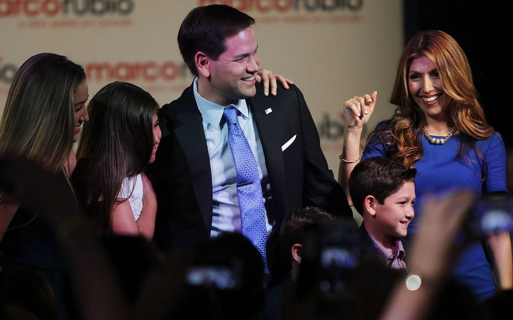 US Republican Senator from Florida Marco Rubio with his family after announcing his presidential candidacy on April 13, 2015 at The Freedom Tower in Miami