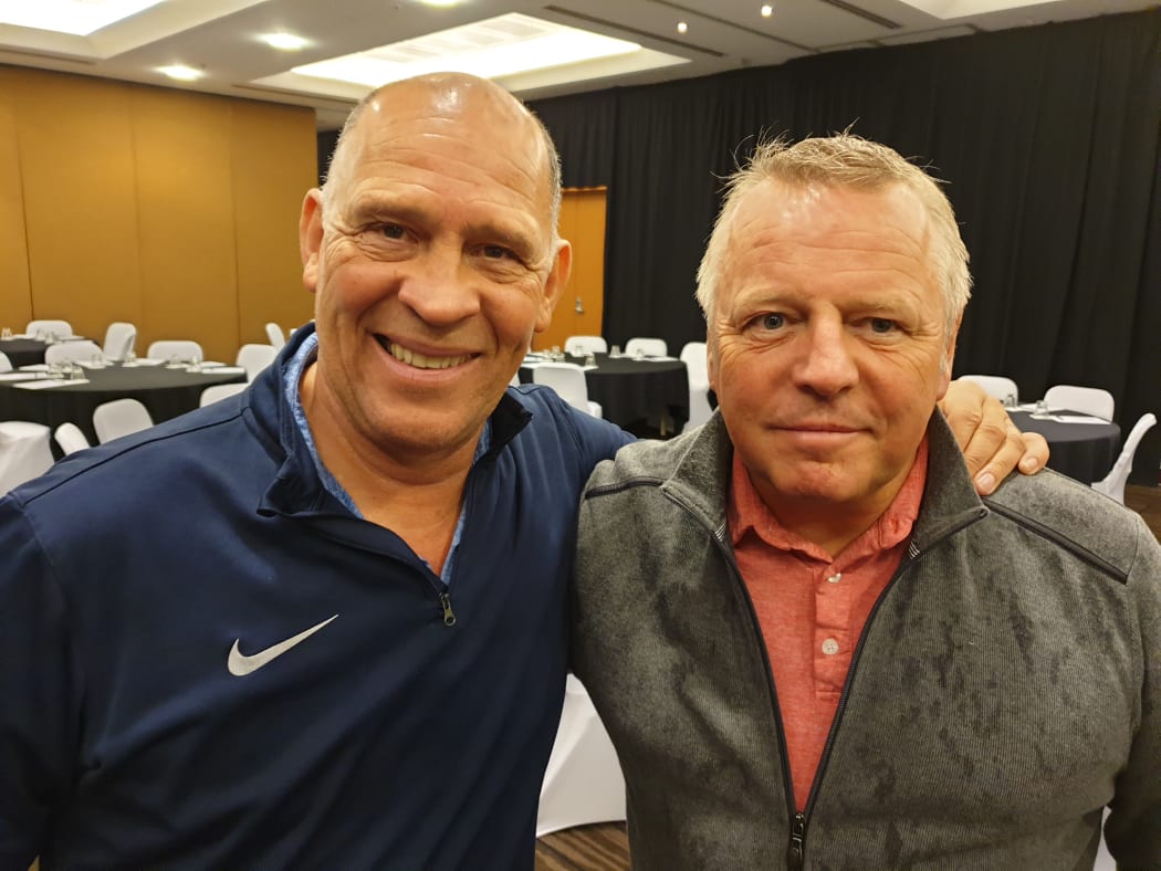 Referee Russ Bray (L) and MC John McDonald.