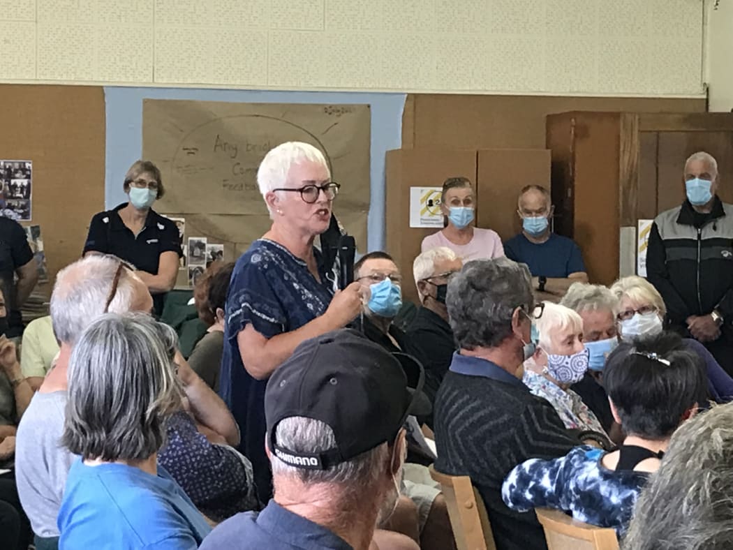 Onerahi airport neighbour Judy Sidon talks to worried residents at a community meeting