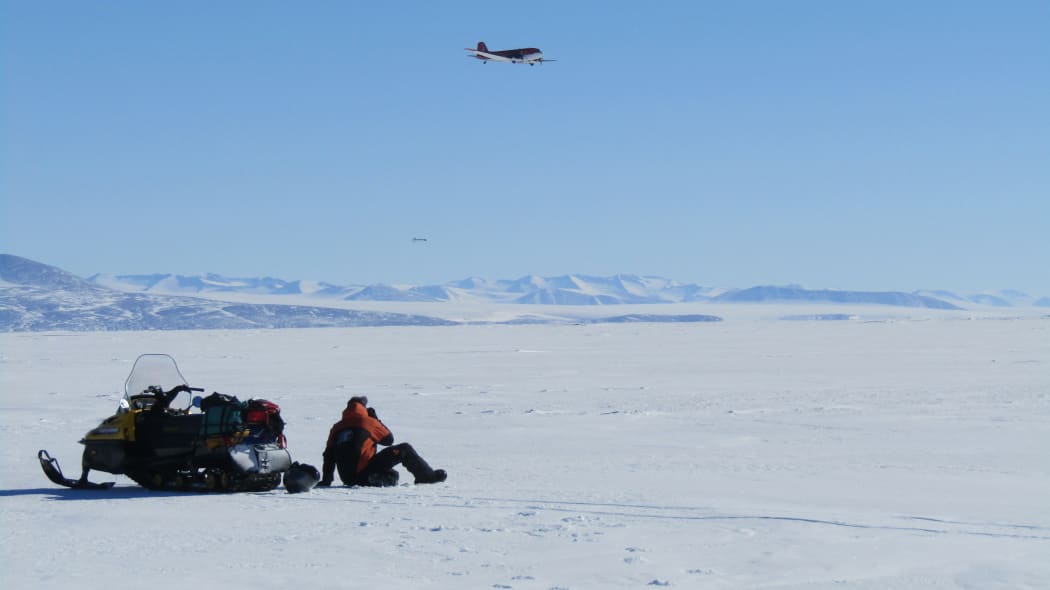 Rosie the EM bird being flown over sea ice