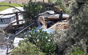 Officials work at the scene of todays landslide at the Beachside Holiday Park in Mt Maunganui.22 January 2026 Photograph by Alan Gibson.
