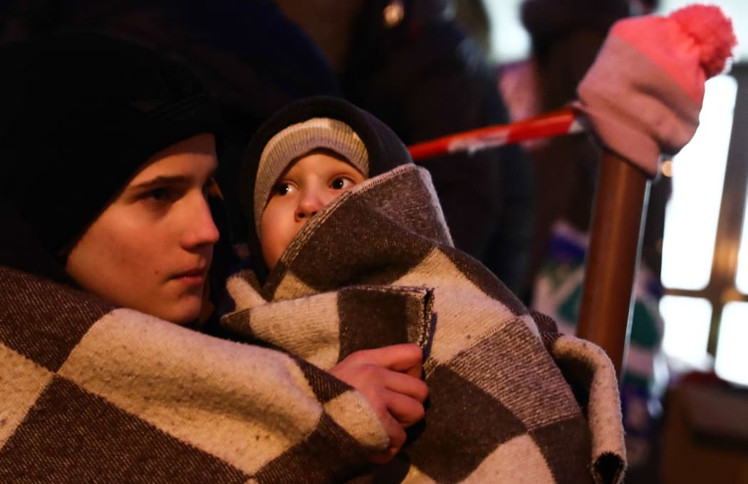 People fleeing from Ukraine arrive at the train station in Przemysl, Poland on March 2, 2022.