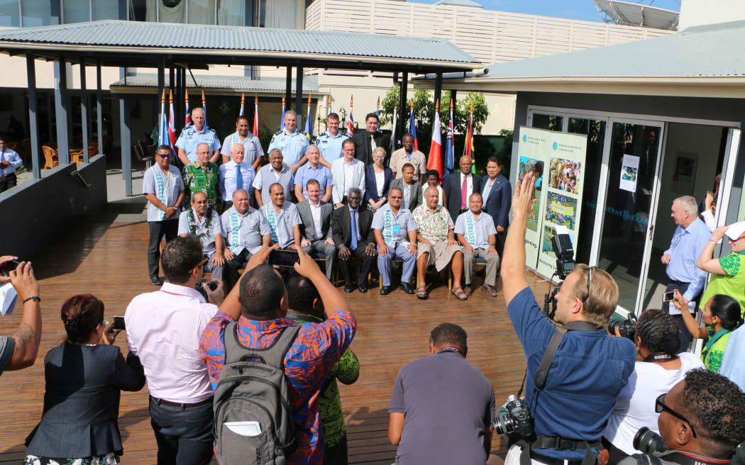 The media pack making the most of the photo op of Pacific Islands leaders posing with some of the great minds behind RAMSI including, senior Police executives, former RAMSI special coordinators and politicians as well as regional experts.