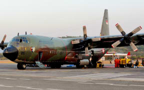 An Indonesian Air Force C-130 on the at Langkawi International Airport flightline.