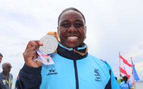 Elenoa Vateitei of Fiji with her spoils on day one of the competition.