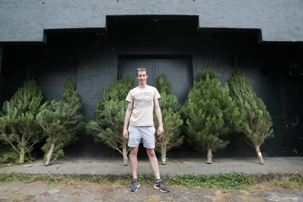 Justin Martin his helping the Te Aro Community Centre with selling Christmas trees for a fundraiser, profits go back inot the community.