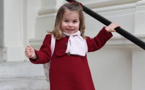 A handout picture released by Kensington Palace shows Britain's Princess Charlotte of Cambridge posing for a photograph before leaving for her first day of nursery at the Willcocks Nursery School.
