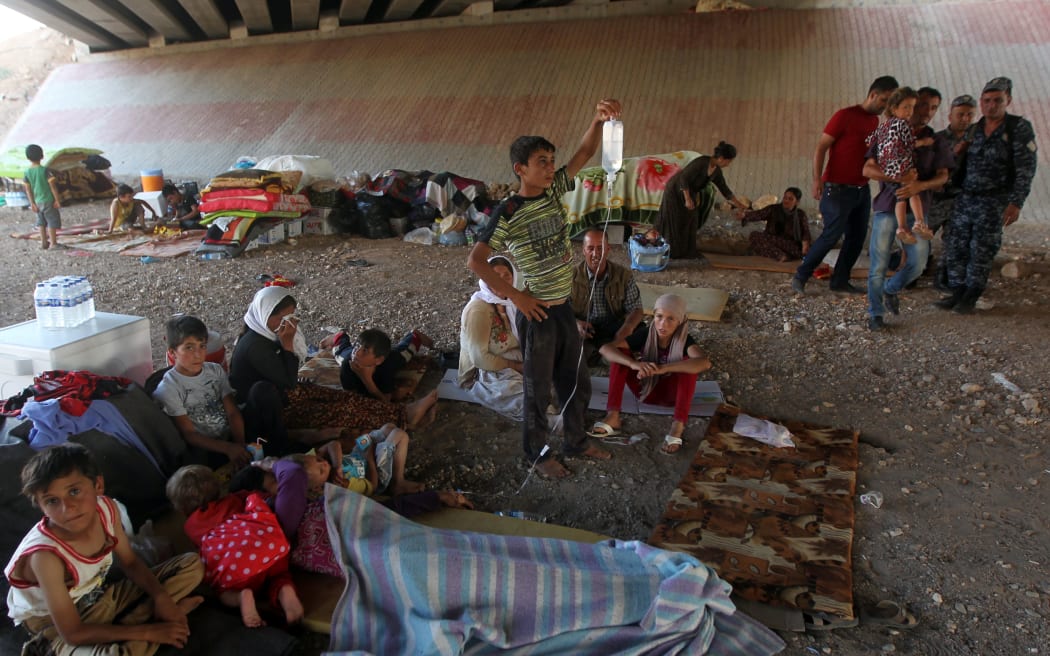 These Iraqi Yazidis fled their homes in the town of Sinjar last week and are now living in a makeshift shelter in the Kurdish city of Dohuk.