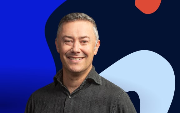 Host Nick Tipping stands in front of background of abstract shapes