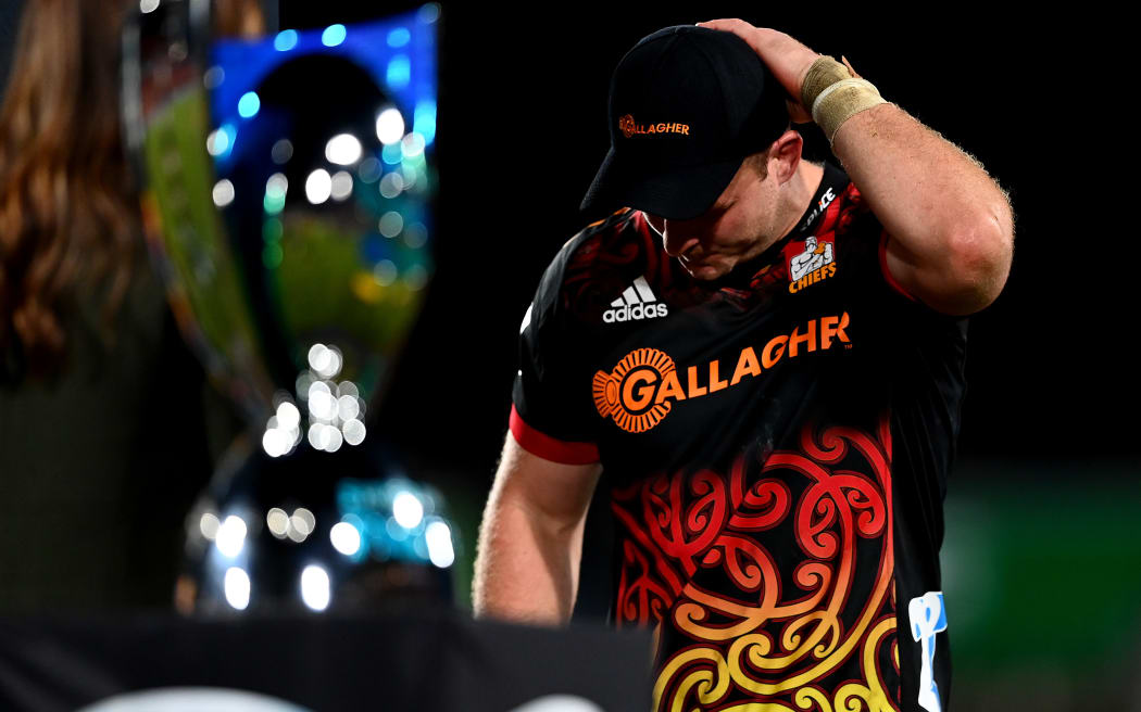 A dejected Sam Cane of the Chiefs walks on stage during the Super Rugby Pacific Final match between Chiefs and Crusaders