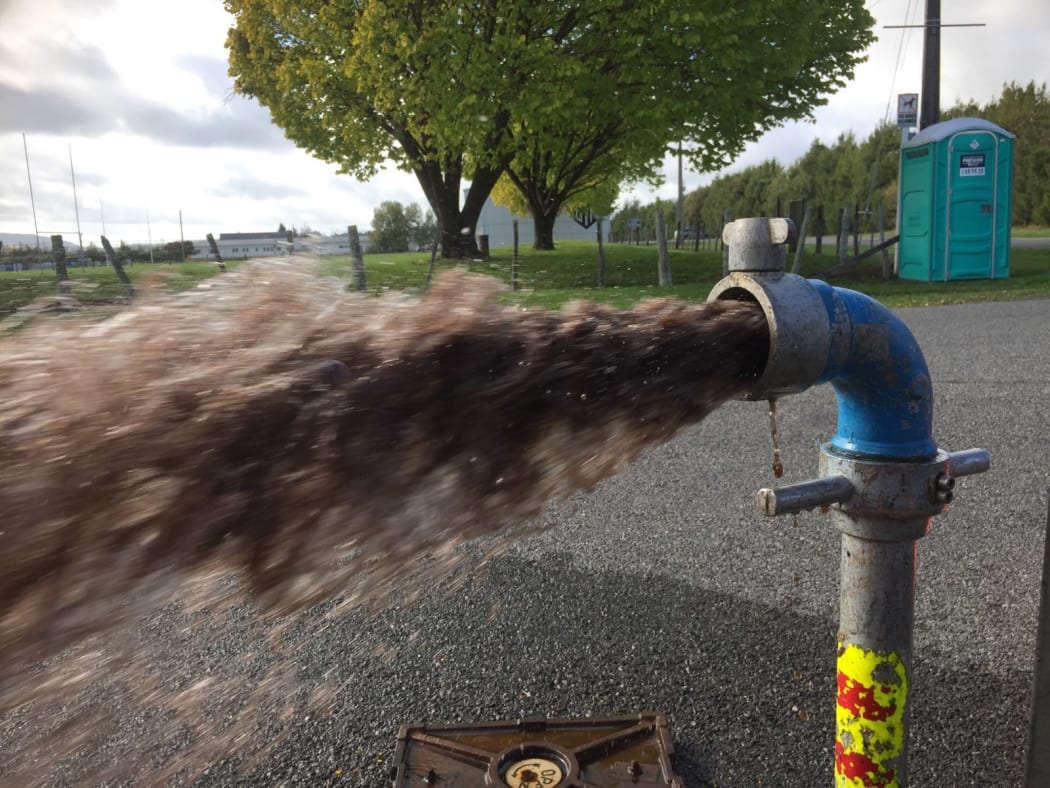 Water is flushed from Martinborough’s water mains. The town’s 2019 E.coli scare brought New Zealand’s infrastructure crisis into sharp focus in Wairarapa.