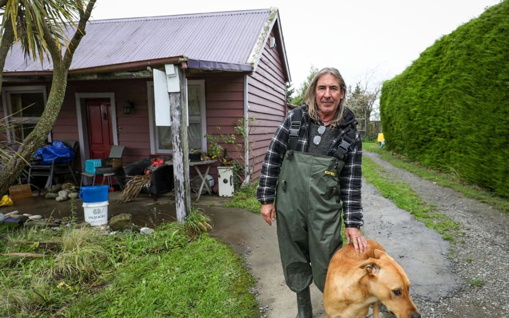 Doyleston resident Tom Dowie says he woke at 4am to find floodwater through his home, which had ruined a number of treasured possessions.