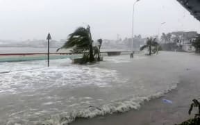 Storm surges sending waves hurtling over streets of Virac along the coast of Catanduanes island, as super typhoon Fung-wong approaches the Philippines.