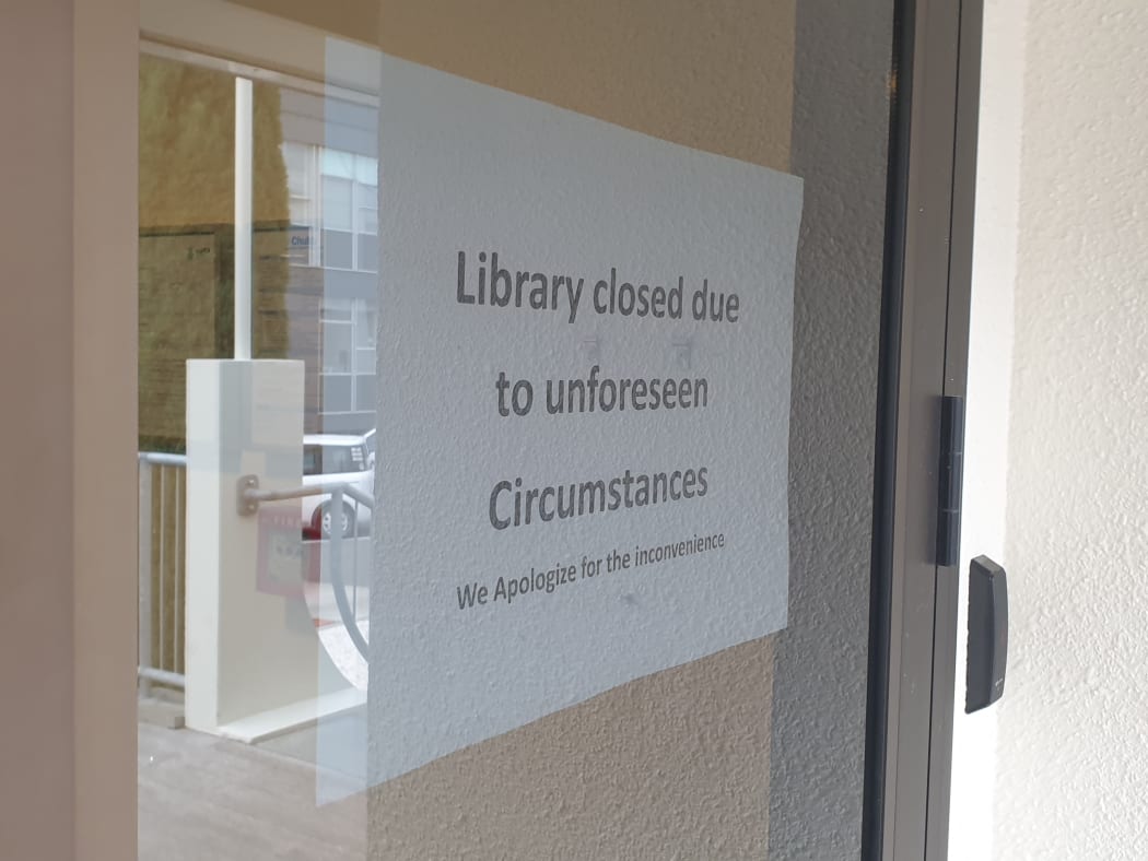 A sign states Napier Library has been closed.
