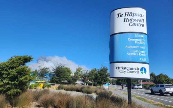 Smoke can be seen from the evacuation centre that has been set up at Halswell Library and Community Centre.