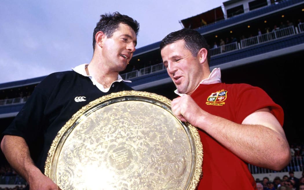 Lion's captain Gavin Hastings and All Black captain Sean Fitzpatrick hold up the shield after the rugby union test match between the British Lions and the All Blacks, 1993.