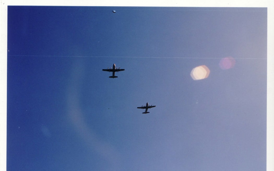 In 2001 on Auckland's North Shore, Grant Whitehouse took this photo, which he believes contains a UFO.