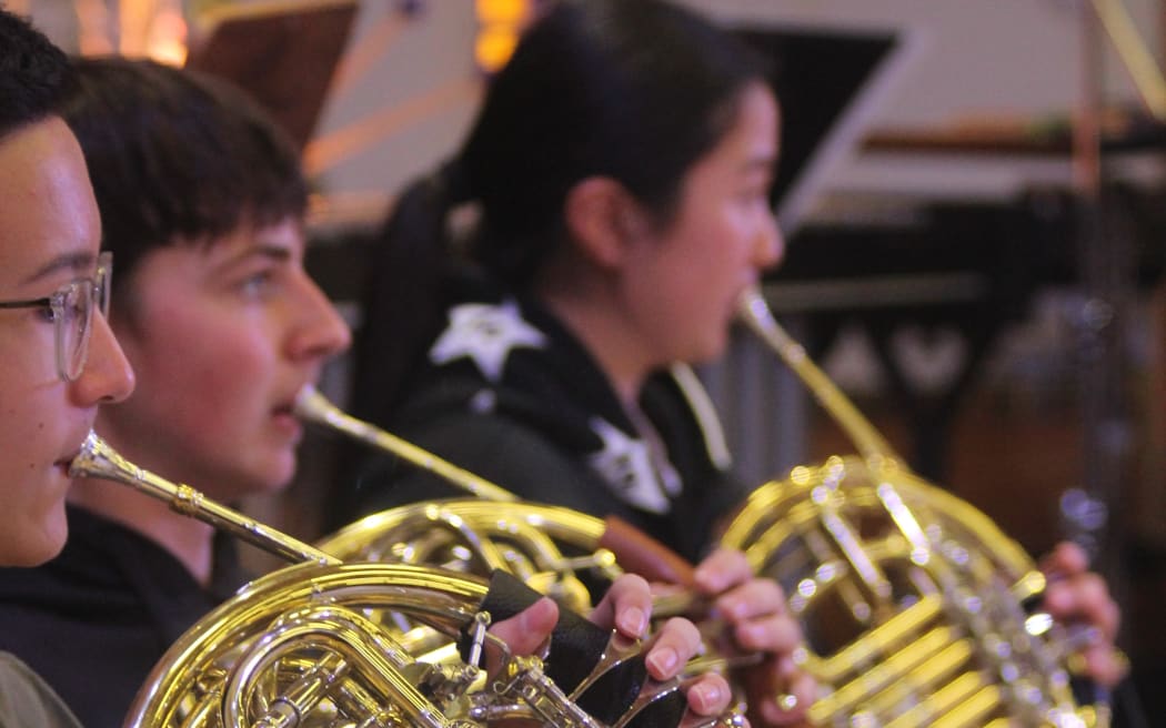 Members of the horn section, New Zealand Secondary Students' Symphony Orchestra 2024