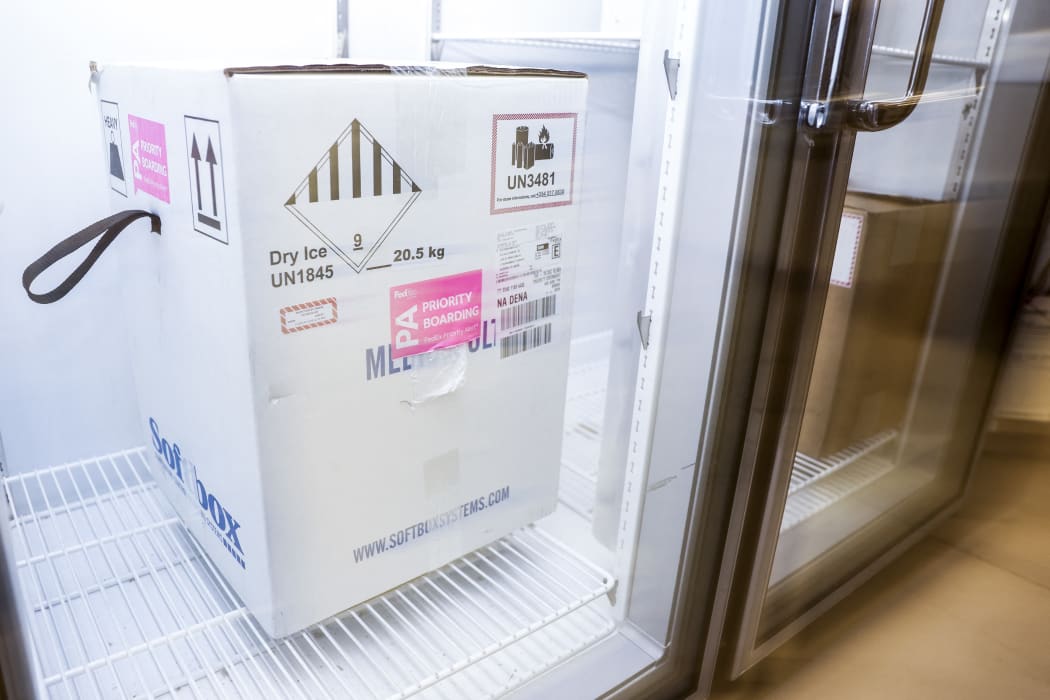 A box containing a shipment of the Pfizer-BioNTech Covid-19 vaccine sits in a freezer at a Colorado medical centre.