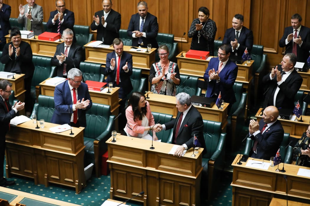 Prime Minister Jacinda Ardern shakes hands with Deputy Prime Minister Winston Peters at the end of her speech in the Budget 2018 debate.
