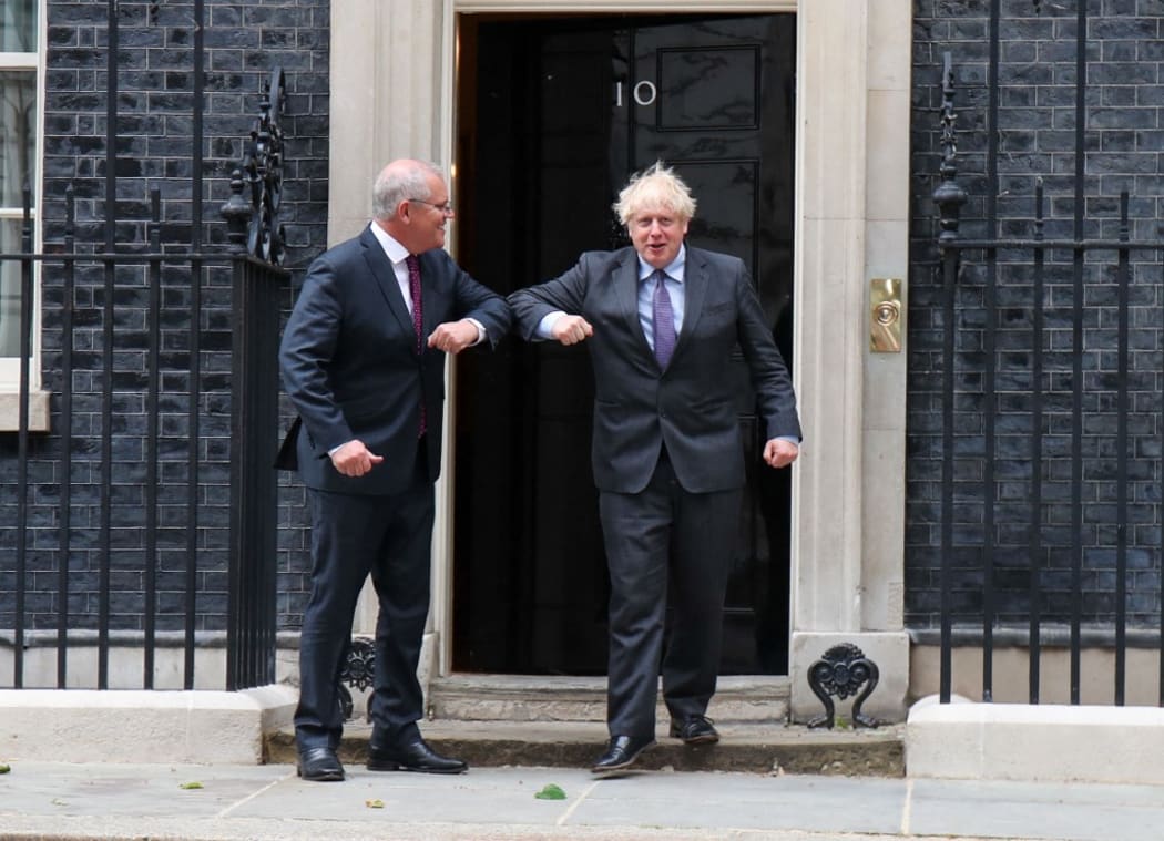 British Prime Minister Boris Johnson greets Australian Prime Minister Scott Morrison outside the door of 10 Downing Street, London, UK on 14th June 2021.