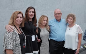 Right to left: Bruce, Jeanette and Sarah McEachen, the parents and sister of Matthew McEachen, stand with Lauren and Deb Conley, the stepsister and stepmother of Rachel Conley.