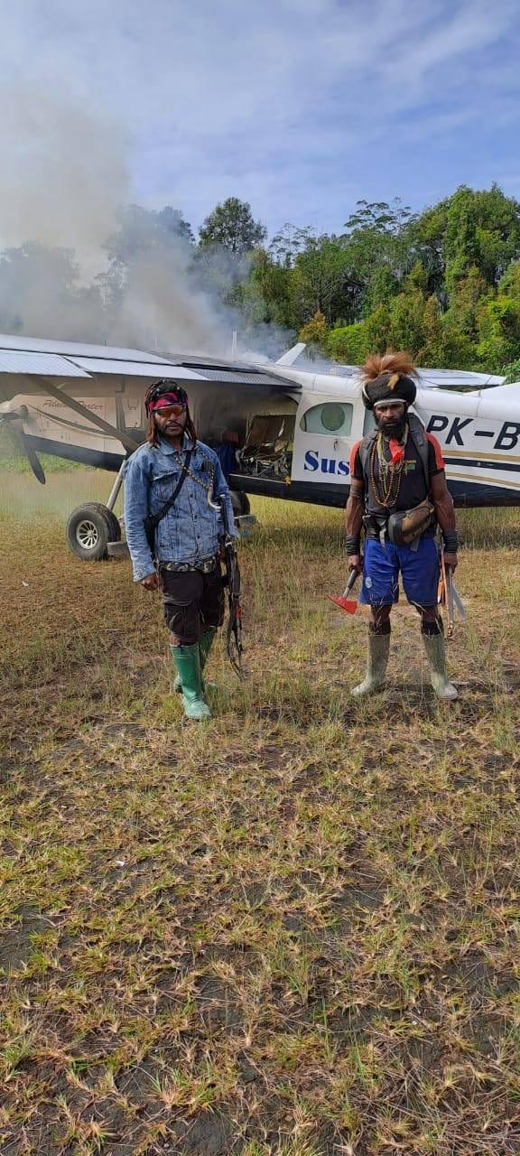 West Papua Liberation Army rebels torch the plane that Phillip Mehrtens was piloting
