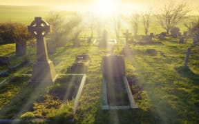 Heavenly light shining upon a old graveyard in England, United Kingdom.