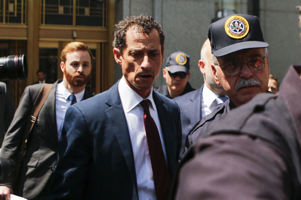 Anthony Weiner leaves court in Manhattan after pleading guilty to one charge of sending obscene messages to a minor.