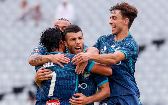 Jaushua Sotirio of the Phoenix celebrates with teammates.