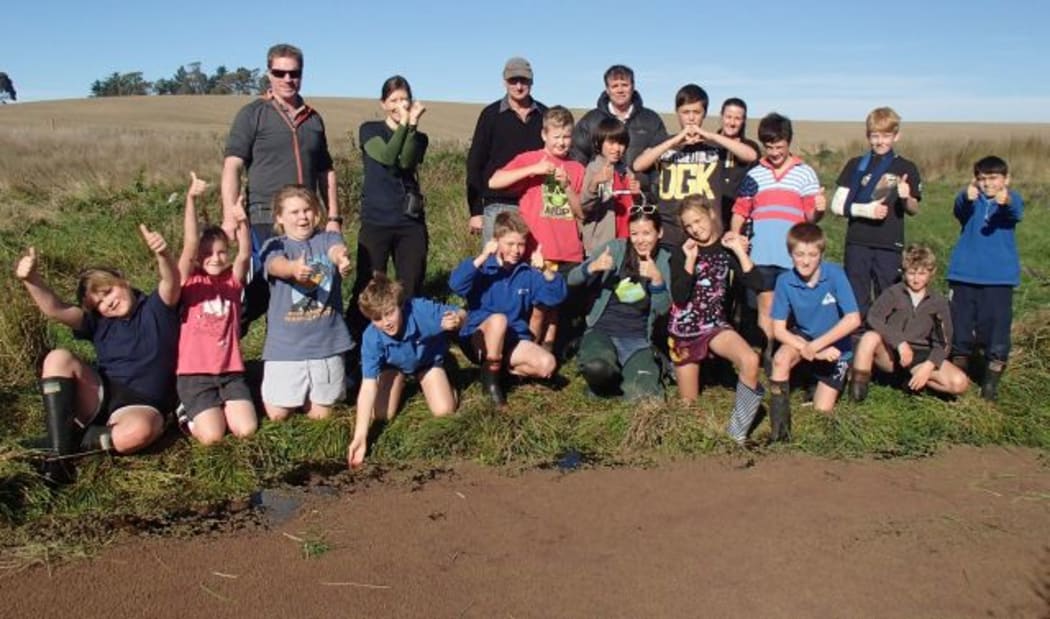 A class from St Andrew's primary school at the Canterbury mudfish ponds on Ross Rathgen's farm.