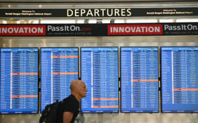 Departure monitors show canceled and delayed flights at Ronald Reagan Washington National Airport on July 19, 2024, in Arlington, Virginia, during a major worldwide computer systems outage. The outage has wrought havoc on computer systems worldwide, grounding flights across the globe, including in Europe and the US, derailing television broadcasts in the UK and impacting telecommunications in Australia. US carriers Delta and United Airlines grounded all their flights earlier on July 19 over communication issues, the Federal Aviation Administration said. (Photo by Mandel NGAN / AFP)