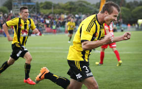 The Wellington Phoenix striker Joel Griffiths celebrates scoring a goal.