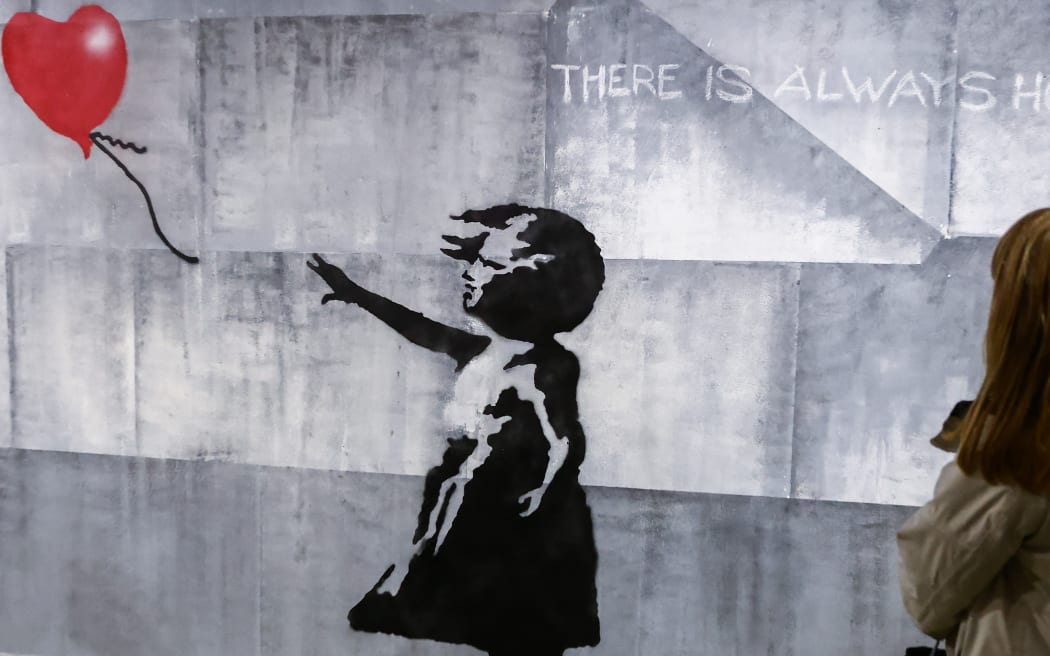 'A girl with balloon' mural reconstruction is seen inside Banksy Museum in Krakow, Poland on January 20th, 2024 at an exhibition inspired by Banksy's street art