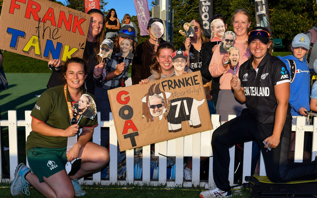 Frances Mackay of the White Ferns with members of her fan club.
