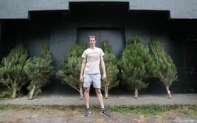 Justin Martin his helping the Te Aro Community Centre with selling Christmas trees for a fundraiser, profits go back inot the community.