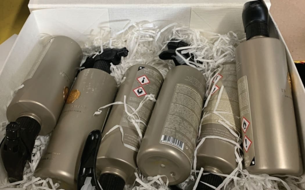 Fragrance bottles that were used to conceal drugs. Seized during Operation Munich.