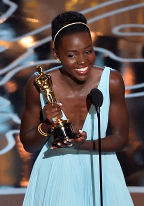 Lupita Nyong'o accepts the Oscar for best supporting actress for 12 Years a Slave.