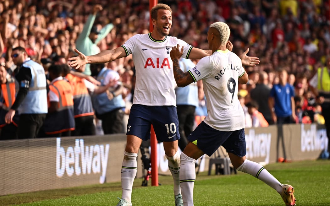Tottenham Hotspur's English striker Harry Kane (L) celebrates with Tottenham Hotspur's Brazilian striker Richarlison (R) after scoring their second goal during the English Premier League football match between Nottingham Forest and Tottenham Hotspur at The City Ground in Nottingham, central England, on August 28, 2022. (Photo by Oli SCARFF / AFP) / RESTRICTED TO EDITORIAL USE. No use with unauthorized audio, video, data, fixture lists, club/league logos or 'live' services. Online in-match use limited to 120 images. An additional 40 images may be used in extra time. No video emulation. Social media in-match use limited to 120 images. An additional 40 images may be used in extra time. No use in betting publications, games or single club/league/player publications. /