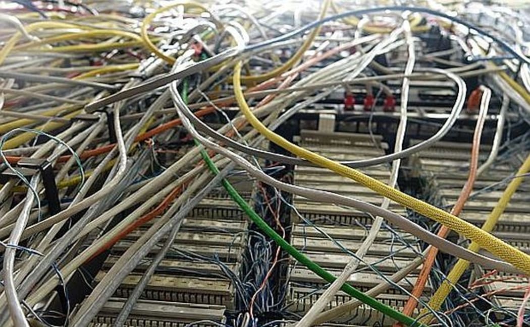 Tangled multi coloured computer wiring.