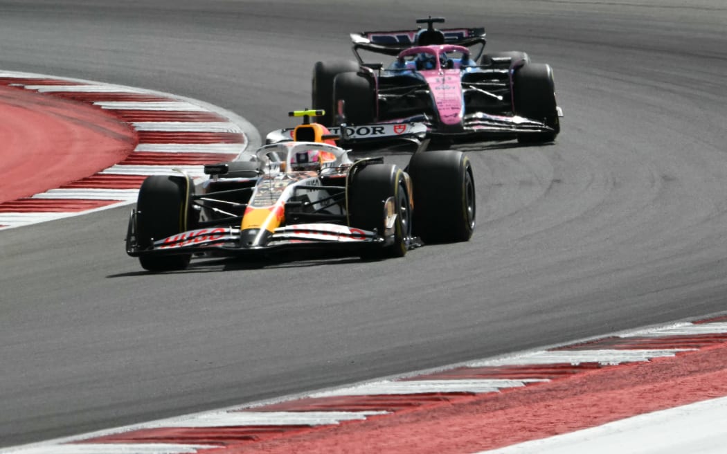 (L/R) RB's New Zealander driver Liam Lawson and Alpine's French driver Pierre Gasly race during the United States Formula One Sprint at the Circuit of the Americas in Austin, Texas, on October 18, 2025. (Photo by RONALDO SCHEMIDT / AFP)