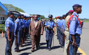 PNG police attend to Prime Minister James Marape as he arrives in Alotau for an official visit to Milne Bay province, 22 August 2020.