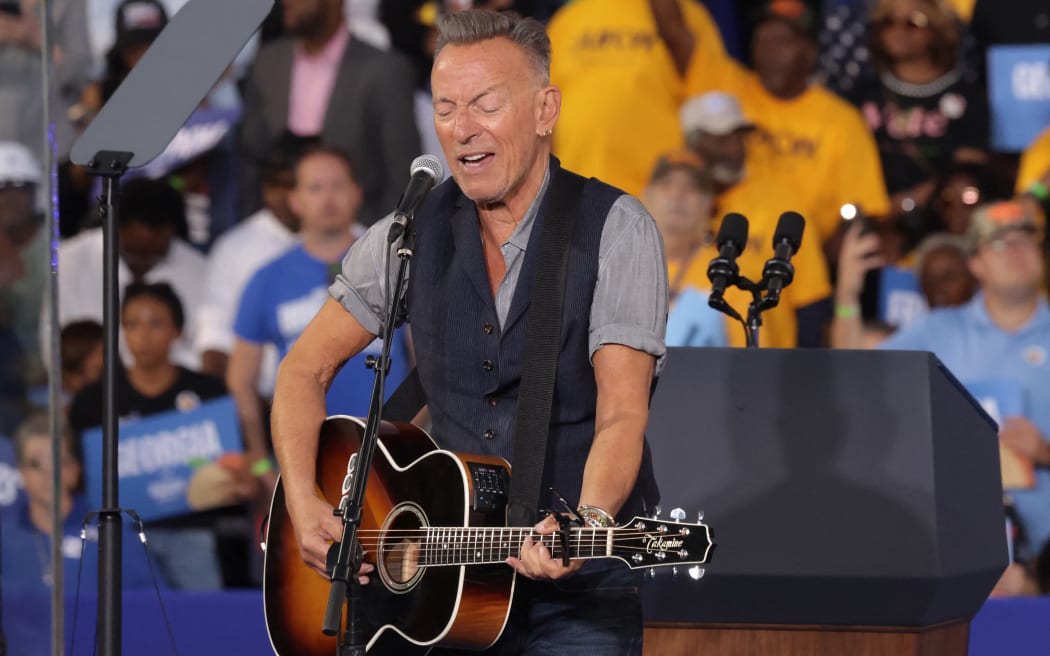 Musician Bruce Springsteen performs during a campaign event for Democratic presidential nominee, US Vice President Kamala Harris with former President Barack Obama at the James R Hallford Stadium on October 24, 2024 in Clarkston, Georgia.