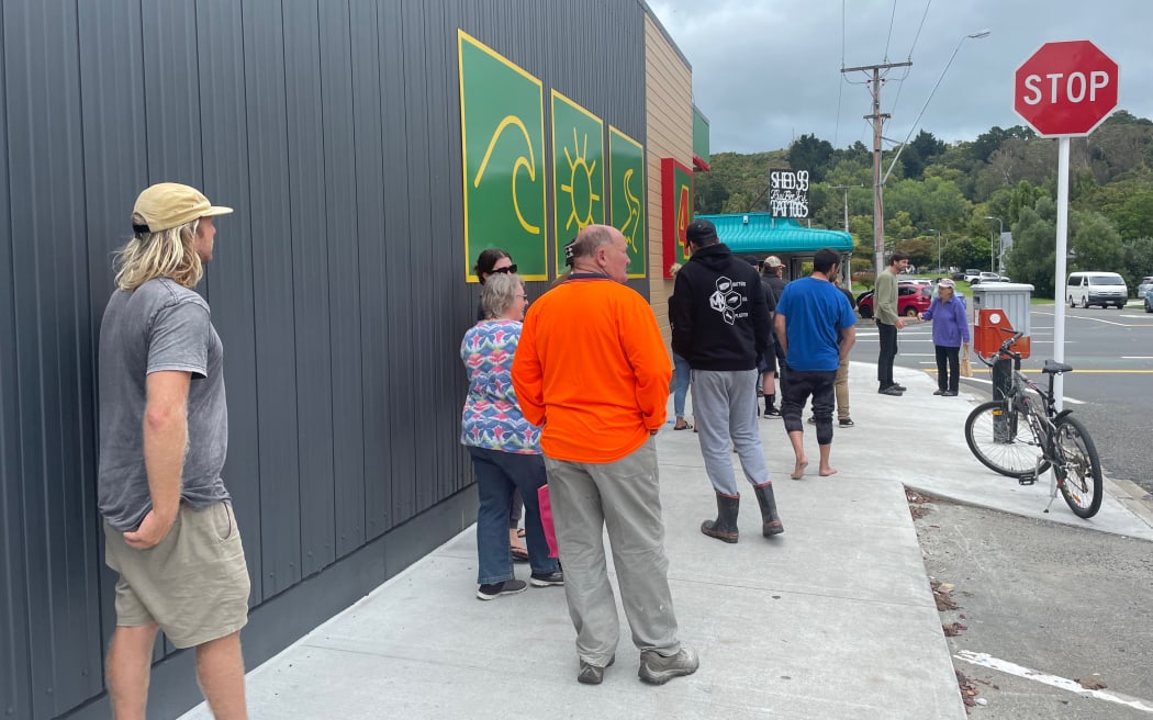 Queues for community supermarkets and petrol stations in Gisborne extended down the street on Wednesday afternoon.