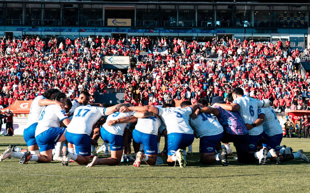 Manu Samoa team bows in prayer after their 31-12 loss to Chile on Sunday morning. Photo: Manu Samoa