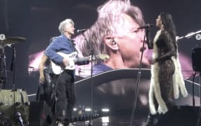Neil Finn with Dua Lipa on stage at Spark Arena 4 April 2025.