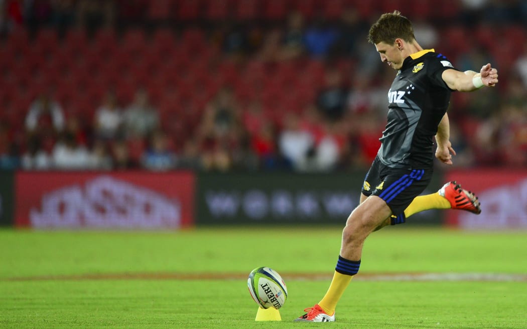 Beauden Barrett kicks for goal for the Hurricanes
